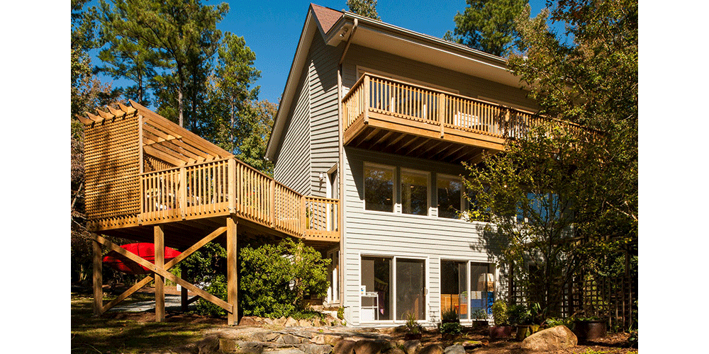 For a multistory structure, an elevated space can be created to reduce the need for stairs. This pine deck was built on treated posts and extends off the middle story.
Photo courtesy of: Steven Paul Whitsitt